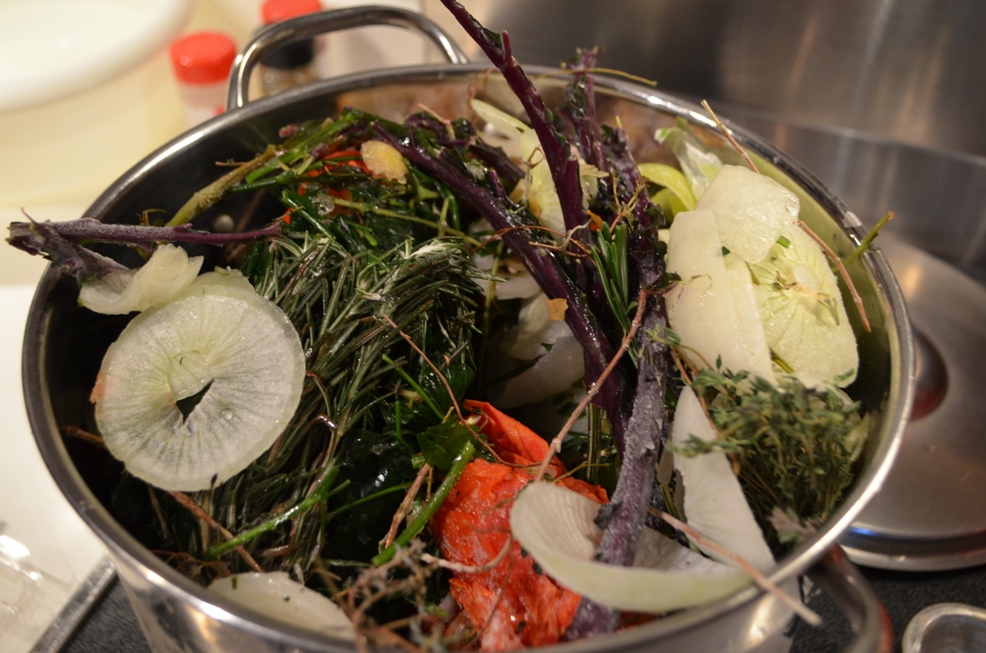 A pot full of veggie & herb scraps collected in a freezer bag and saved for making stock--this is before I smashed them down so don't overfill your pot